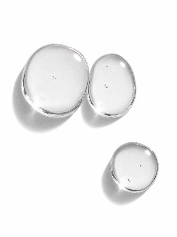 Immaculate Retinol 0.3% Face Serum texture swatch - clear serum drops on a white surface