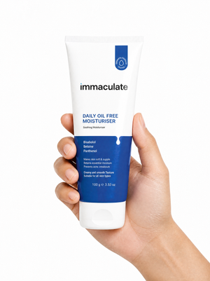 Hand holding the Immaculate Daily Oil-Free Face Moisturiser tube, showing its size and lightweight everyday form