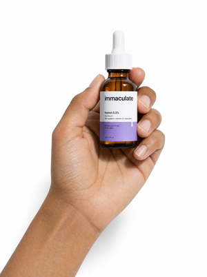 Hand holding the Immaculate Retinol 0.3% Face Serum, showing its size and everyday form