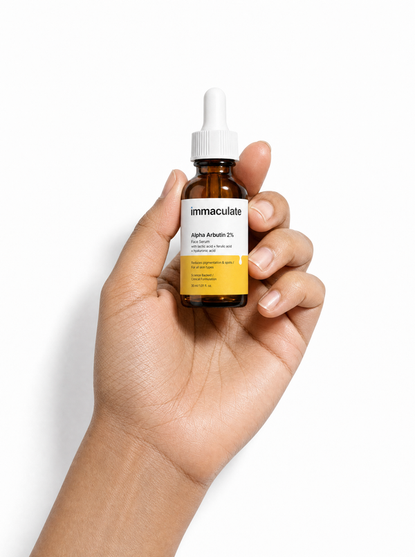 Hand holding the Immaculate Alpha Arbutin 2% Face Serum, showing its size and everyday form