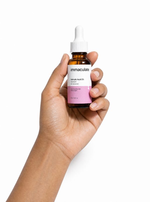 Hand holding the Immaculate Salicylic Acid 2% Face Serum, showing its size and everyday form