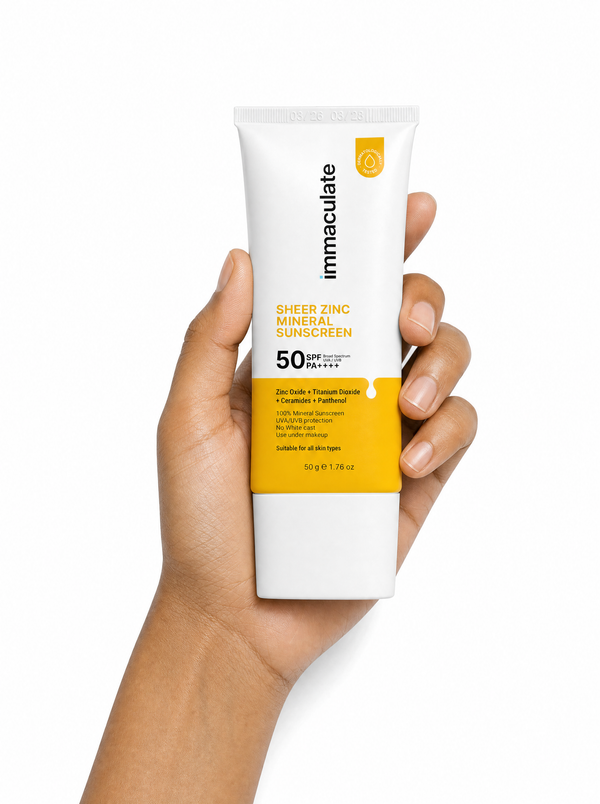 Hand holding the Immaculate Sheer Zinc Mineral Sunscreen, showing its size and everyday form