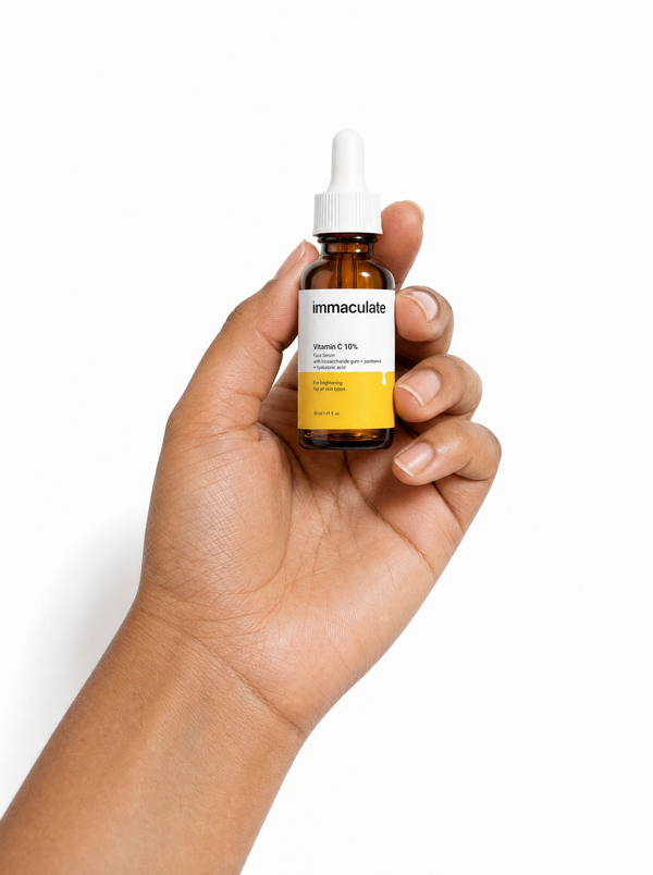 Hand holding the Immaculate Vitamin C 10% Face Serum, showing its size and everyday form